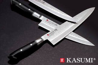 Kasumi knives on black table