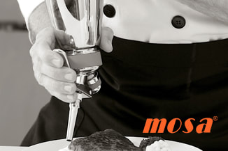 Chef using Mosa cream whipper
